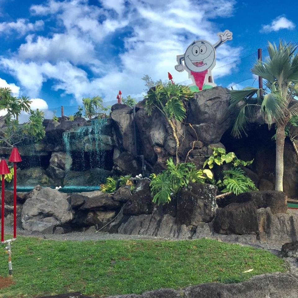 a group of people standing on a rock